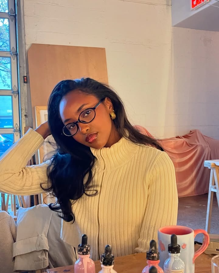 An image of a woman with curled hair.
