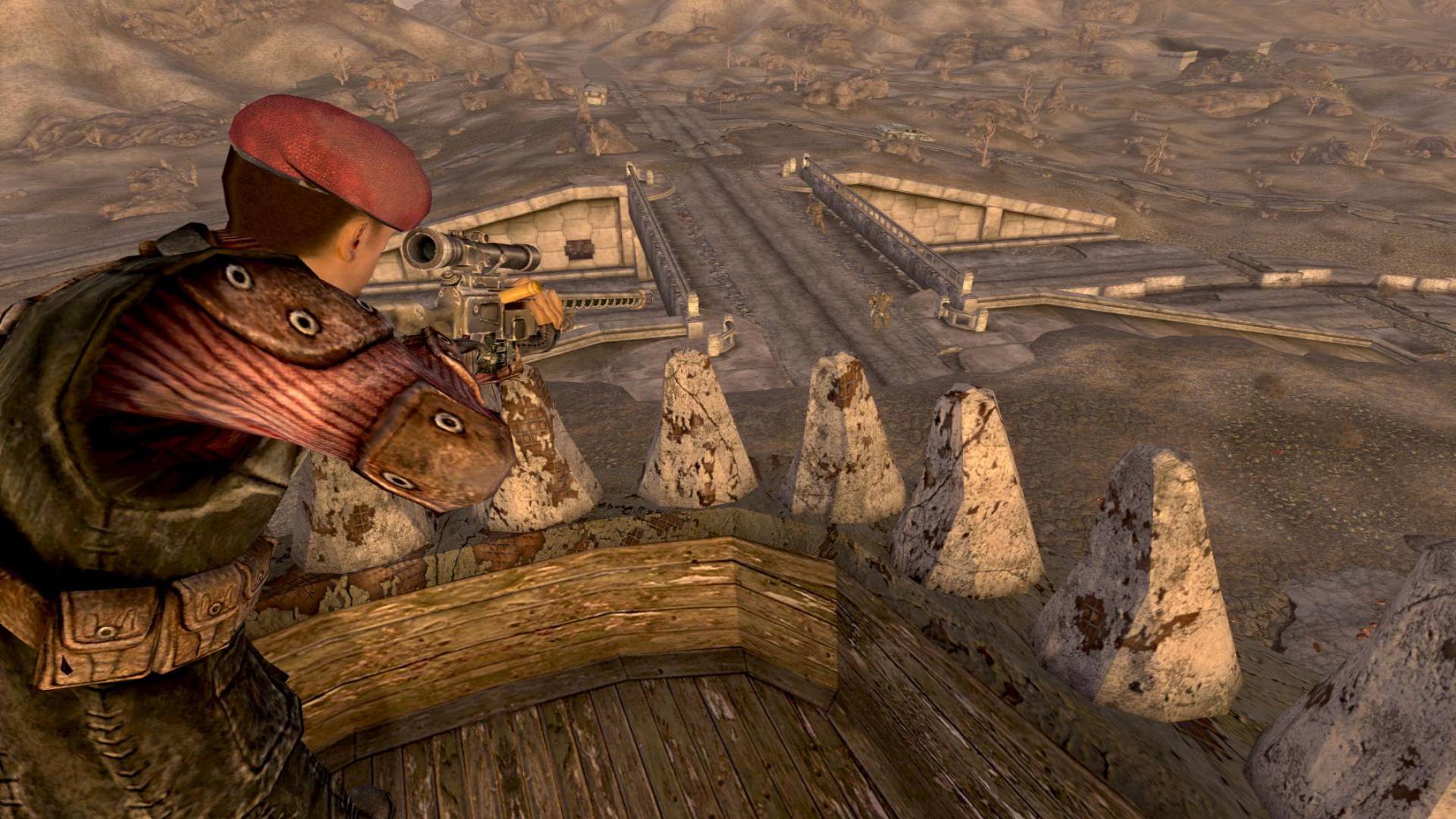 In Fallout: New Vegas, the courier aims a sniper rifle from a nest looking out over the expansive Mojave Wasteland