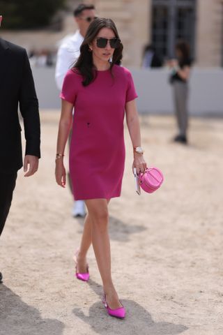 woman wearing pink shift dress