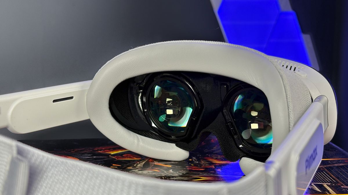 The Pimax Dream Air in white on a stack of PC Gamer magazine.