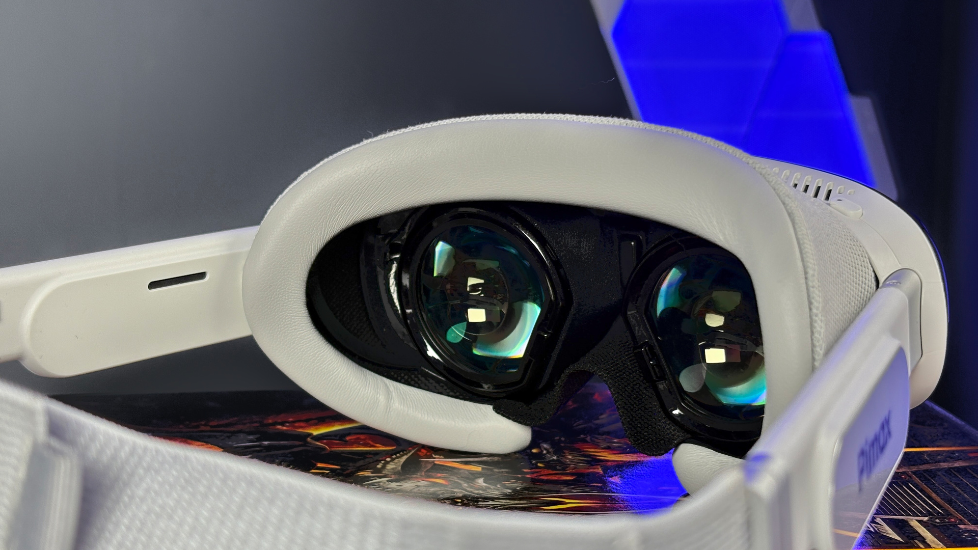 The Pimax Dream Air in white on a stack of PC Gamer magazine.