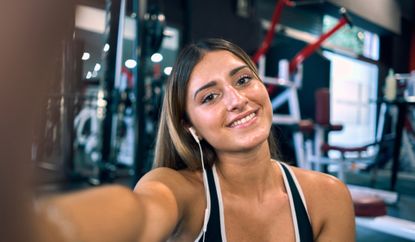Woman taking a selfie in the gym