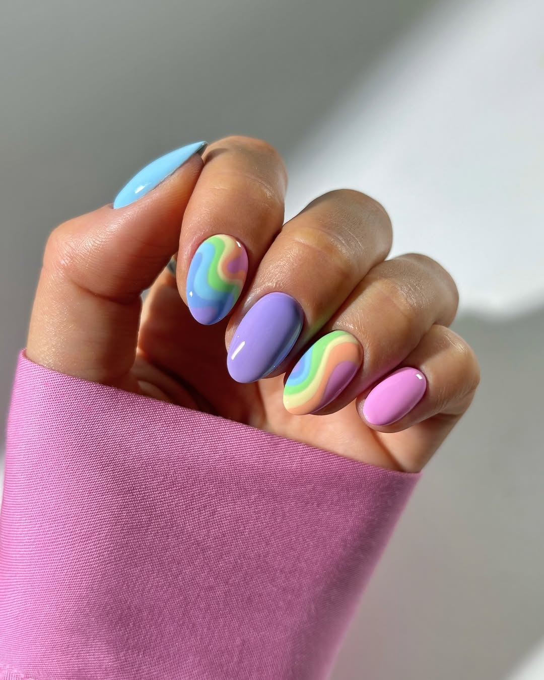 pastel nails with rainbow squiggles