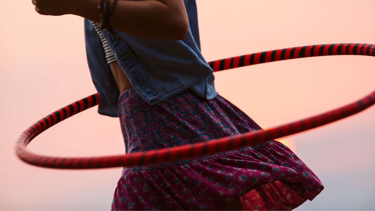 A woman trying hula hoop workouts