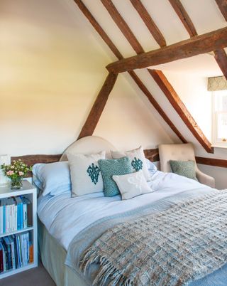 oak frame bedroom with vintage duvet
