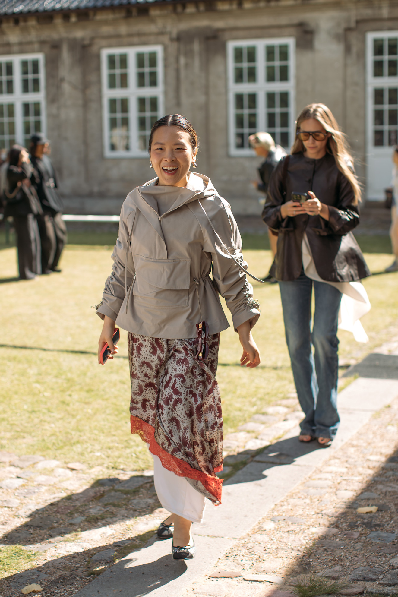 Woman in sporty jacket and skirt