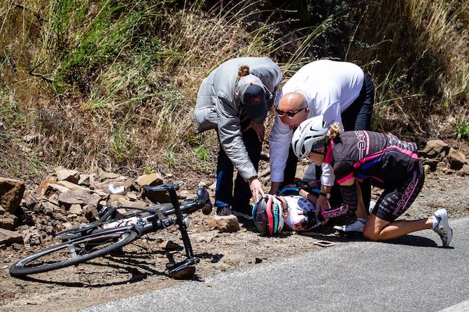 Joscelin Lowden (Drops) is attended to after crashing on one of the descents during stage 1 of the 2019 Tour of California Women's Race