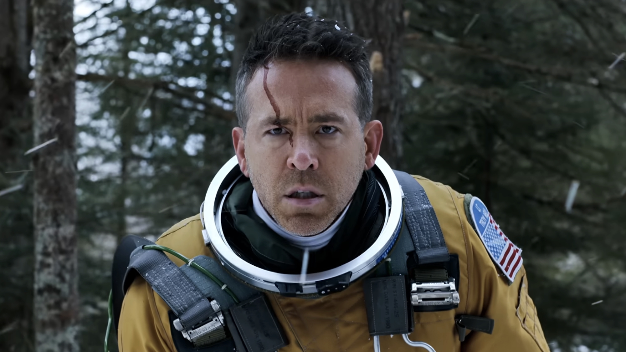 Troy "Assassin" Kelly in flight suit without a helmet standing outside in Mayday