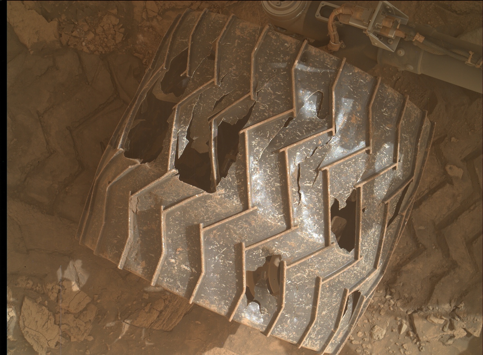 Another MAHLI image of Curiosity's wheels taken on Jan. 27, 2022. The damage isn't as bad as it looks, mission team members say, and Curiosity should be able to keep roving for a while yet.
