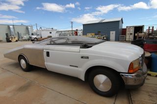 A modified Ford F-250 truck known as the "Trunnel," which was designed to allow XCOR to test a one-third scale model of its Lynx suborbital space plane on the runway at California's Mojave Air and Space Port.