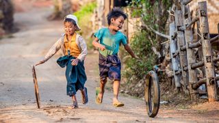 Two boys make their own fun in this photo, captured by Eric Tkindt&nbsp;in Kalaw, Myanmar.