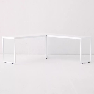 A white corner-shaped shelf riser