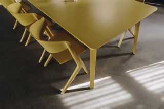 Yellow coloured chair and table