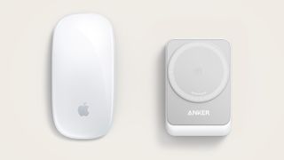 Anker MagGo Wireless Charging Station next to an Apple Magic Mouse for size comparison