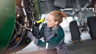 engineer working on aircraft engine