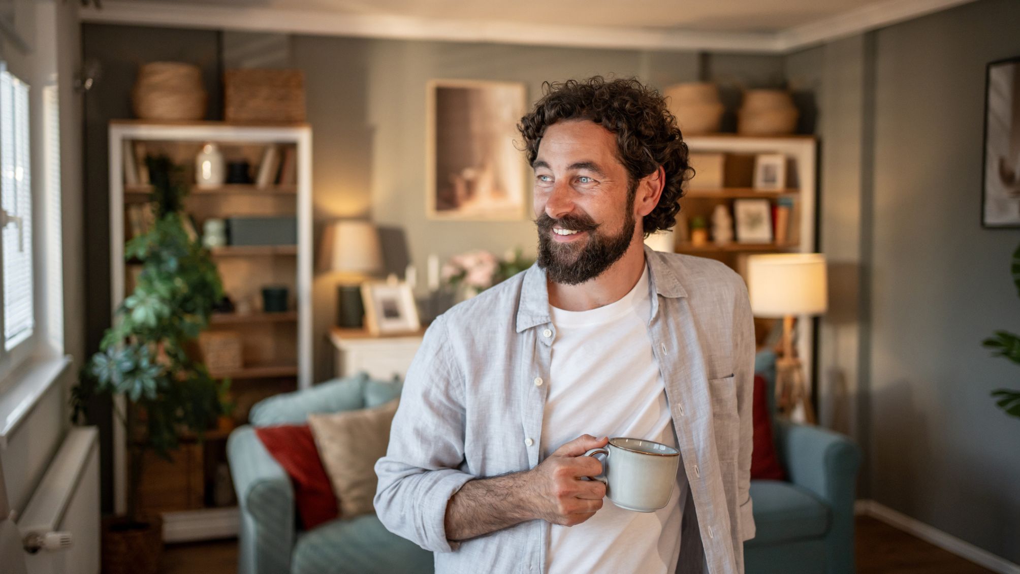 A man sipping coffee and enjoying his morning.