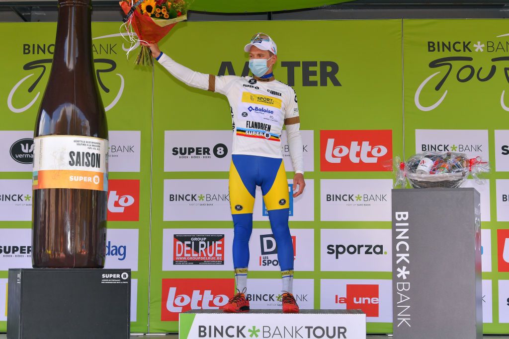 AALTER BELGIUM OCTOBER 01 Podium Kenneth Van Rooy of Belgium and Team Sport Vlaanderen Baloise White Most Combative Rider Jersey Celebration Mask Covid safety measures Flowers during the 16th BinckBank Tour 2020 Stage 3 a 157km stage from Aalter to Aalter BinckBankTour BinckBankTour on October 01 2020 in Aalter Belgium Photo by Luc ClaessenGetty Images
