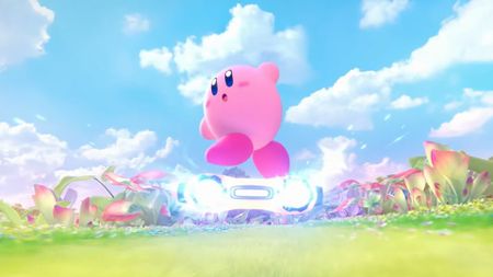 Kirby rides a jet-powered warp star in the announcement teaser for Kirby Air Riders, over a lush green race course