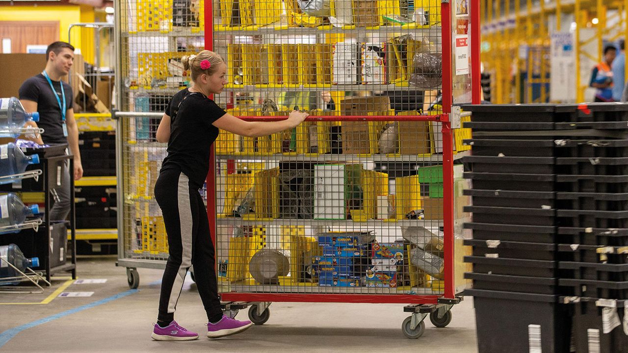 Amazon warehouse workers © Geoffrey Robinson / Alamy Stock