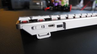 The ROG Falchion RX gaming keyboard in white set up on a desk.