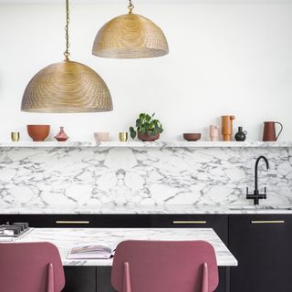 kitchen with spangle pendants and marble table
