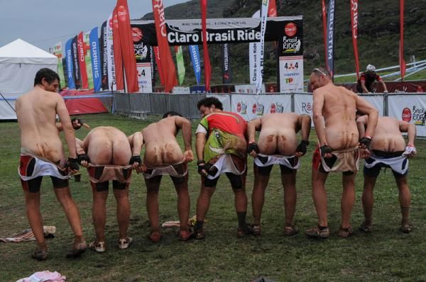 Racers show off their saddles sores at the end of the Brasil Ride