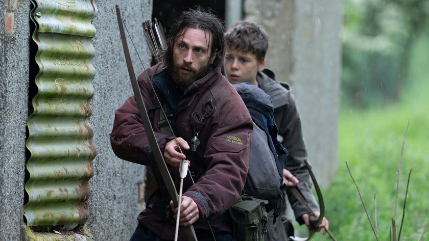 Aaron Taylor-Johnson leads Alfie Williams through an outdoor scene in 28 Years Later,