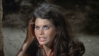 Sherry Lansing holds her face as she cries on the ground in Rio Lobo.