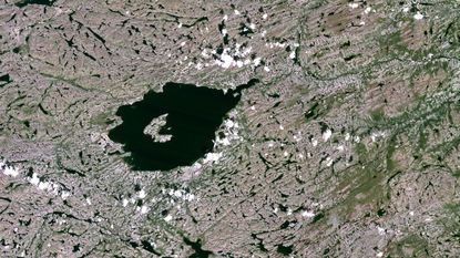 The rock was found within the Mistastin impact crater in Labrador, Canada, shown here in this satellite image.