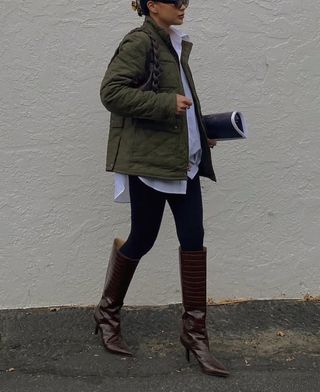 Basics to Wear With Leggings: @dawn.tan wears leggings with an Oxford shirt, puffer coat and knee boots