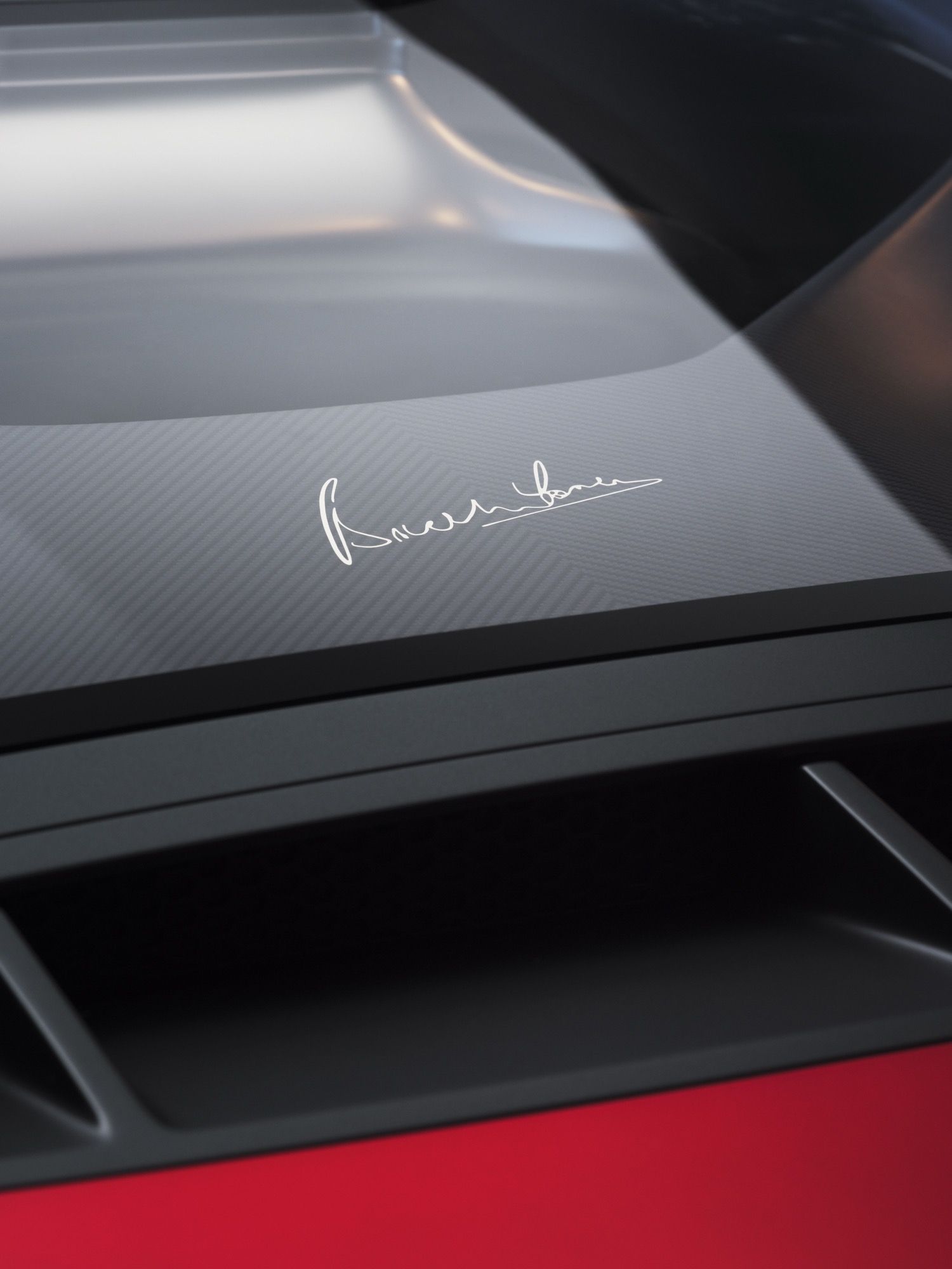 Details of the new McLaren McL6GT, finished in a deep red, looking like a 1970s American racer.