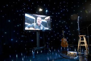 Chris Hadfield performed his portion of I.S.S. ("Is Somebody Singing") from the International Space Station's cupola.
