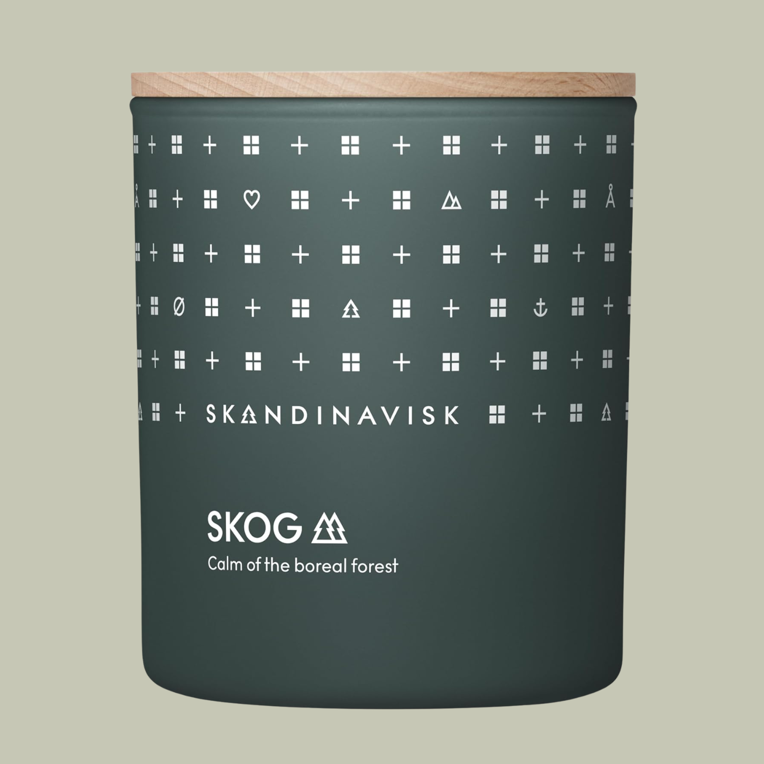 A green forest-scented candle