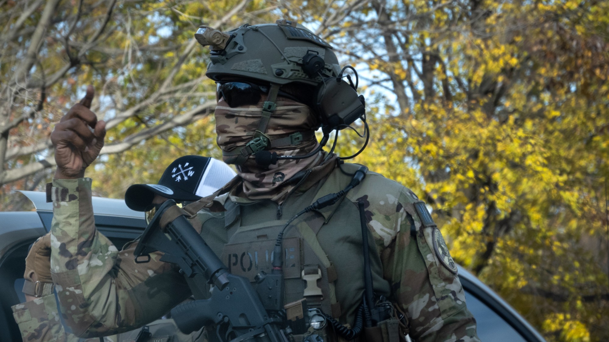 A masked ICE agent is seen in Chicago.