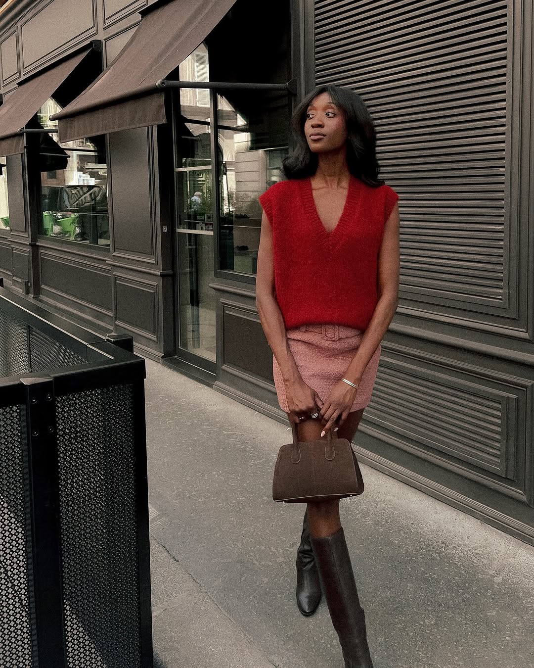 woman wearing knee high fitted boots
