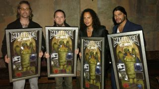 Metallica holding plaques in 2003
