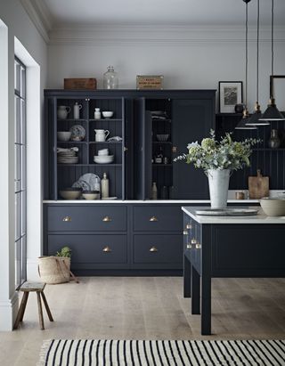 marble worktops in a modern Kitchen Makers dark blue kitchen