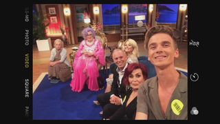 Selfie care! Joe Sugg snaps a photo with Dame Edna and guests during filming. Picture Shows: Mabel, Dame Edna Everage, Emily Atack, Rob Rinder, Sharon Osbourne, Joe Sugg