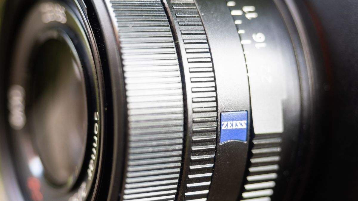 Sony RX1R III on a wooden surface in a woodland environment