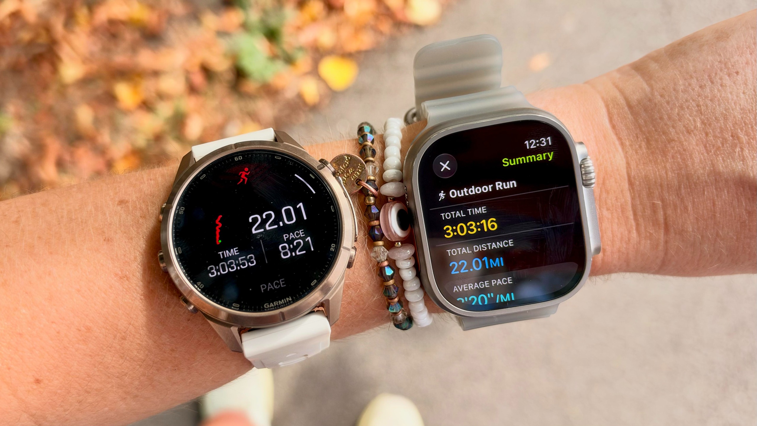a photo of the Apple Watch Ultra 4 and Garmin Fenix 9 Pro on the wrist 