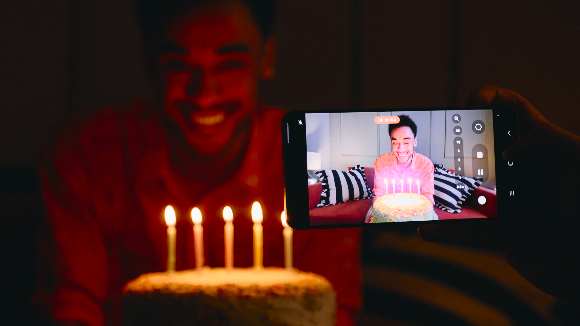 Samsung Galaxy S26 Ultra taking picture of someone with birthday cake