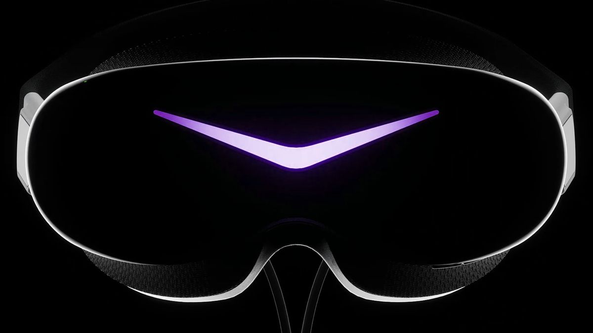 The Pimax Dream Air SE VR headset shot from the front, lit up in purple