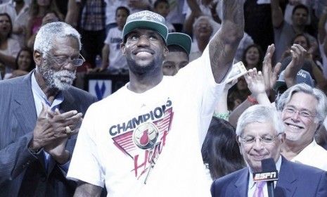 Miami Heat small forward LeBron James holds his MVP trophy after the Miami Heat beat Oklahoma City Thunder 121-106 in Game 5 of the NBA Finals to win the championship.