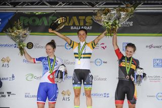 Shannon Malseed on the top step, flanked by Lauren Kitchen and Grace Brown