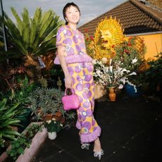 patricia zhou wearing a patterned trouser suit