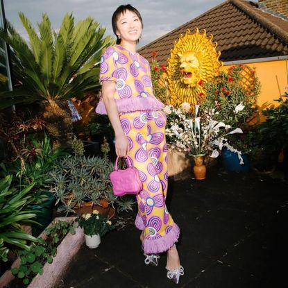 patricia zhou wearing a patterned trouser suit