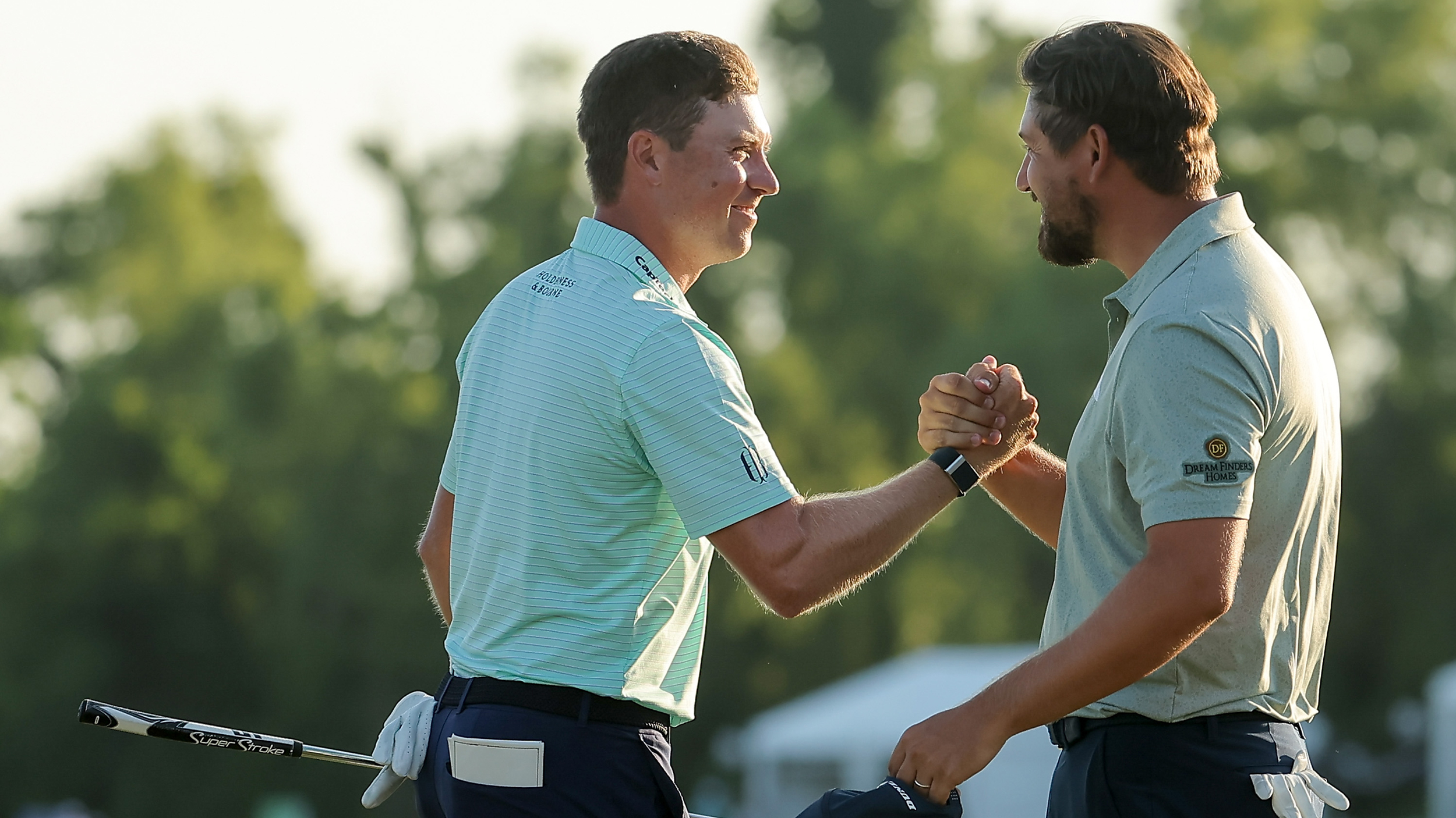 Ben Griffin and Andrew Novak shake hands after winning the 2025 Zurich Classic