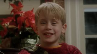 Macaulay Culkin as Kevin McCallister taunting the Wet Bandits in Home Alone