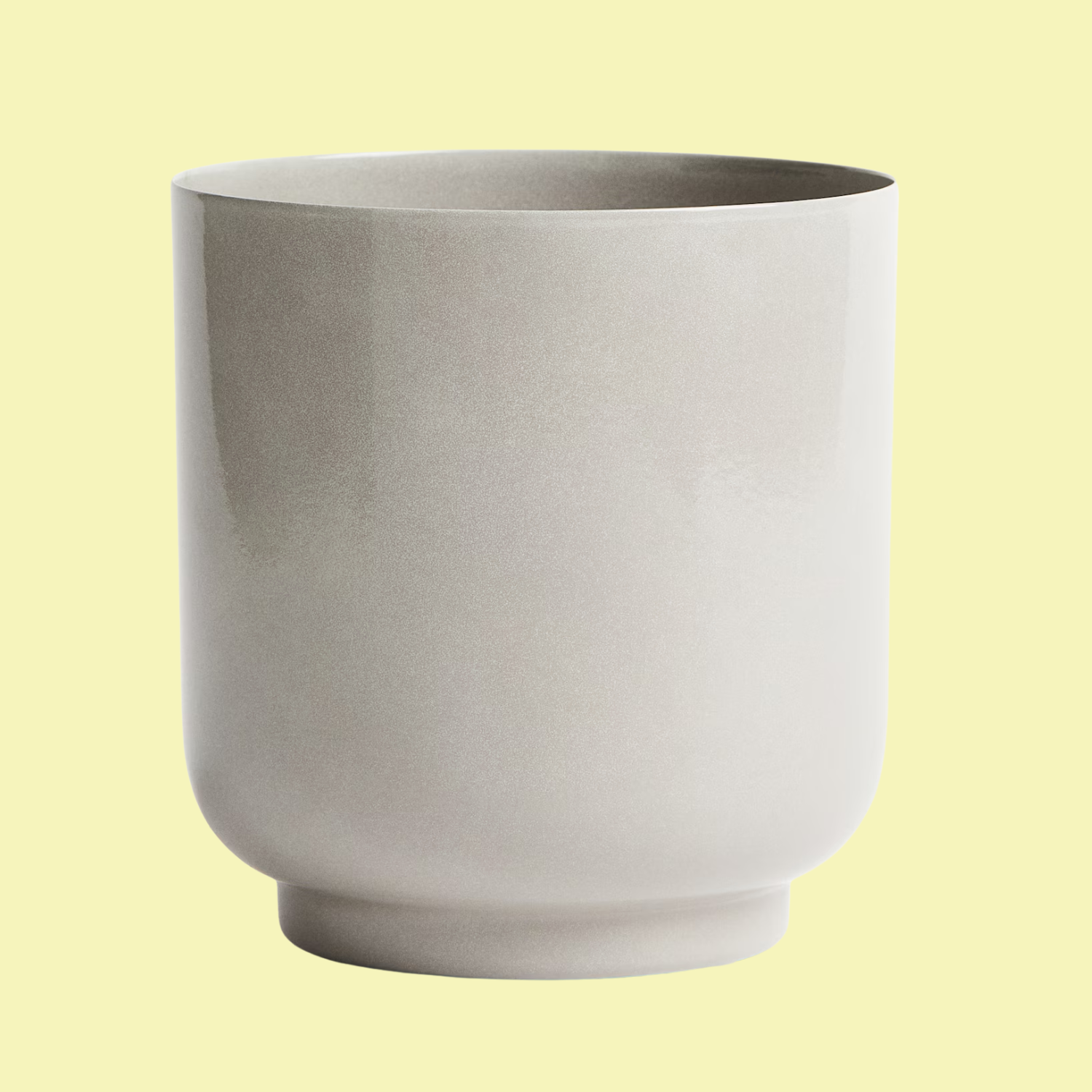 A taupe metal plant pot