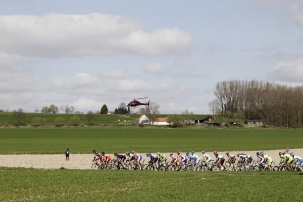 The peloton works its way through the Belgian fields
